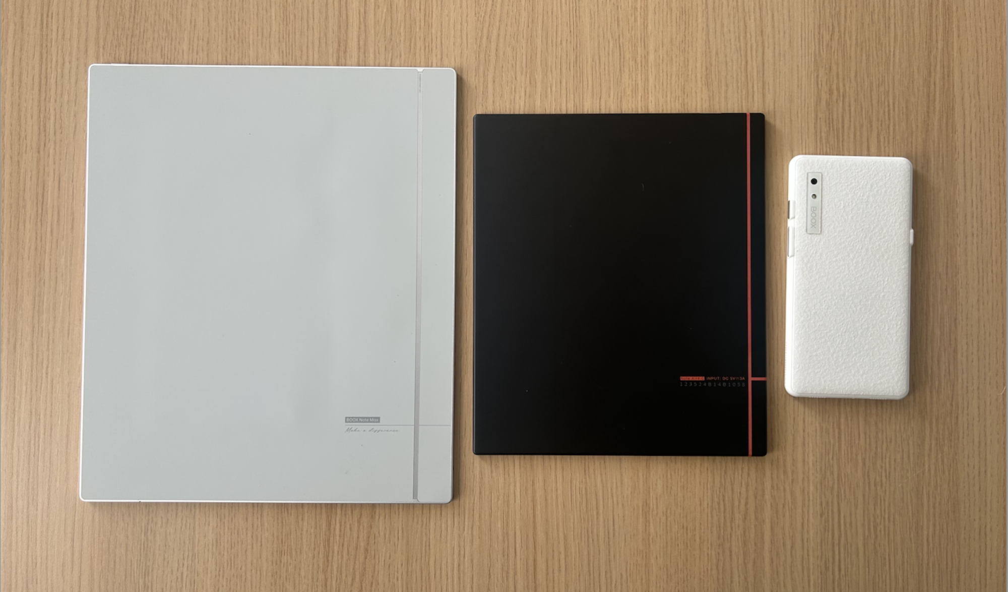 A side by side photo of the Note Max, Note Air4C, and Boox Palma showing size difference