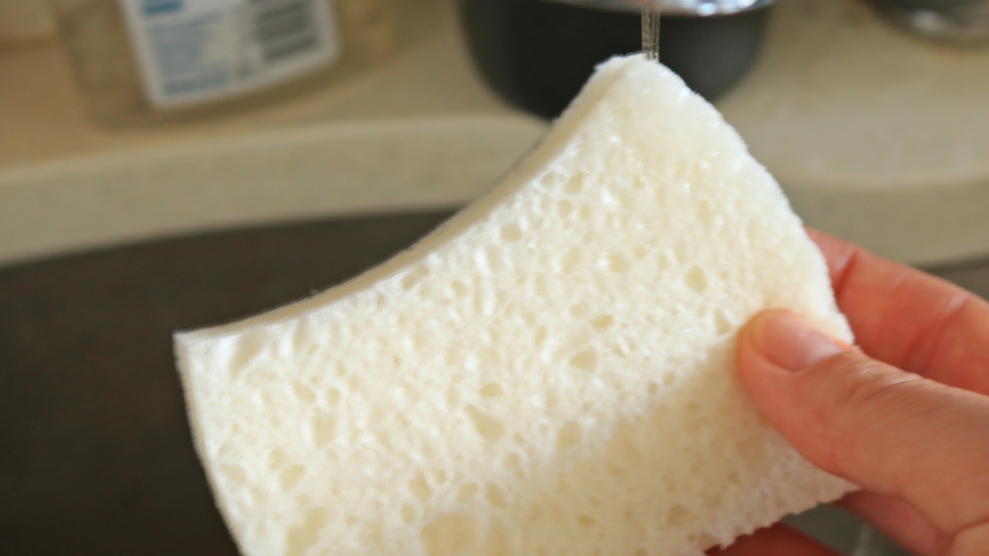 Water flowing over a sponge.